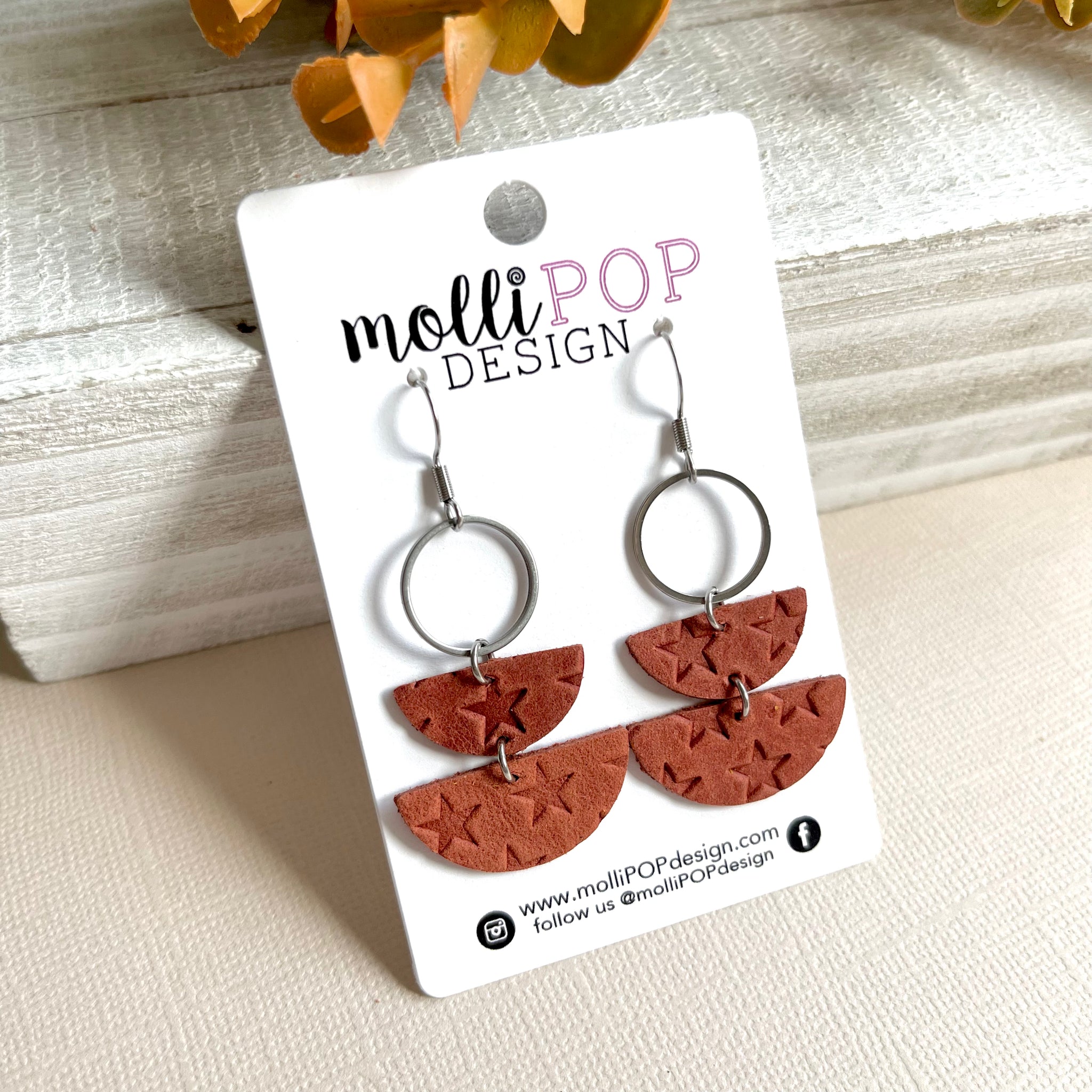 Leather star earrings deals
